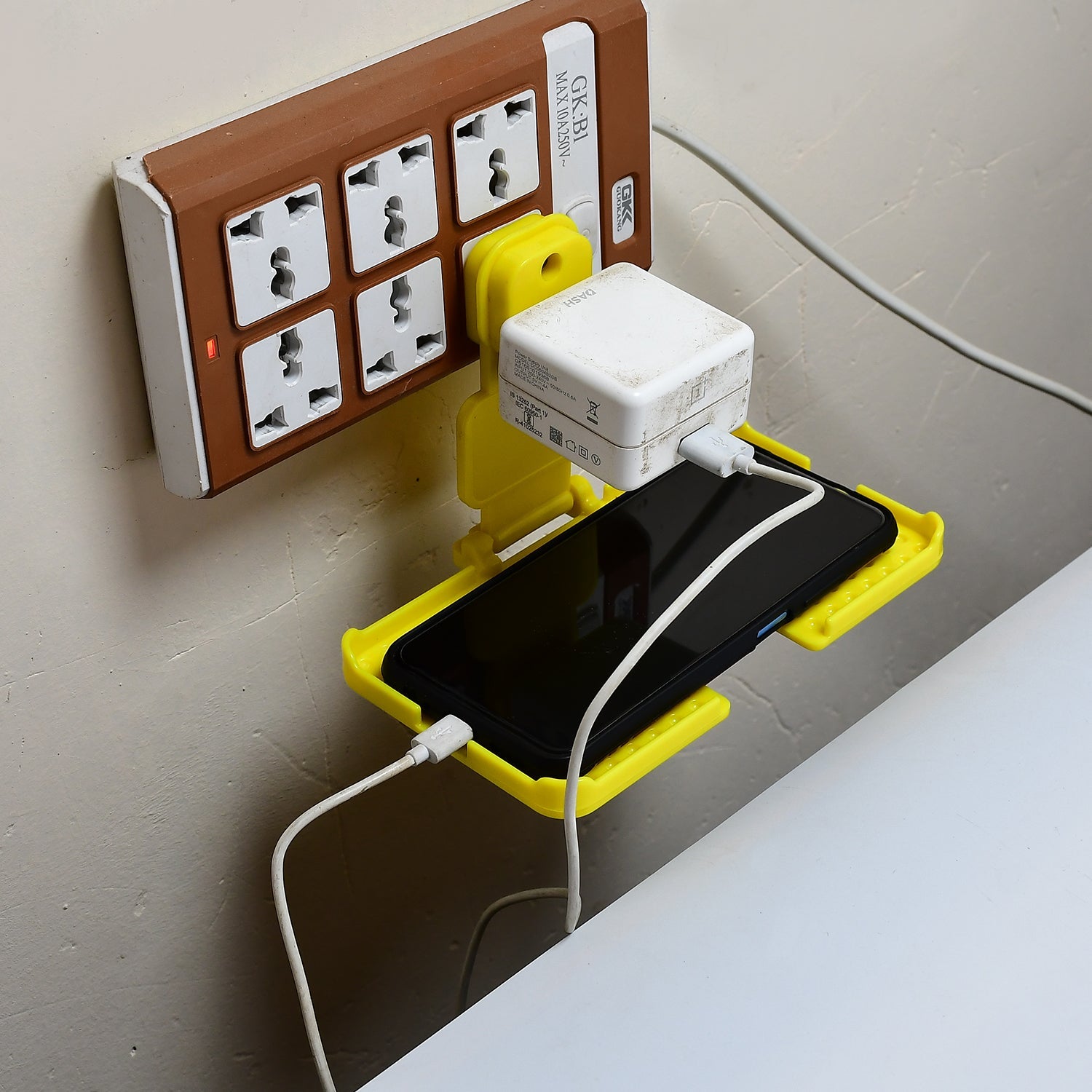 6496Y Multi-Purpose Wall Holder Stand for Charging Mobile Just Fit in Socket and Hang (Yellow) DeoDap 6496Y Multi-Purpose Wall Holder Stand for Charging Mobile Just Fit in Socket and Hang (Yellow) DeoDap